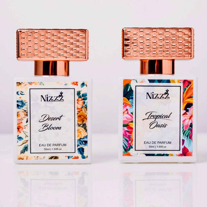 Two Nizzz floral perfume bottles: Desert Bloom & Tropical Oasis, 50ml eau de parfum with rose gold caps