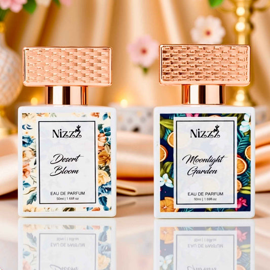 Two Nizzz floral perfumes: Desert Bloom & Moonlight Garden, elegant eau de parfum bottles with rose gold caps