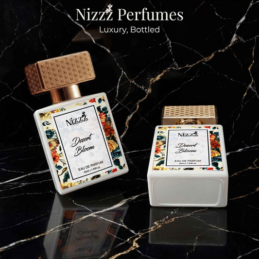 Nizzz Desert Bloom Eau de Parfum bottles with floral labels on black marble background