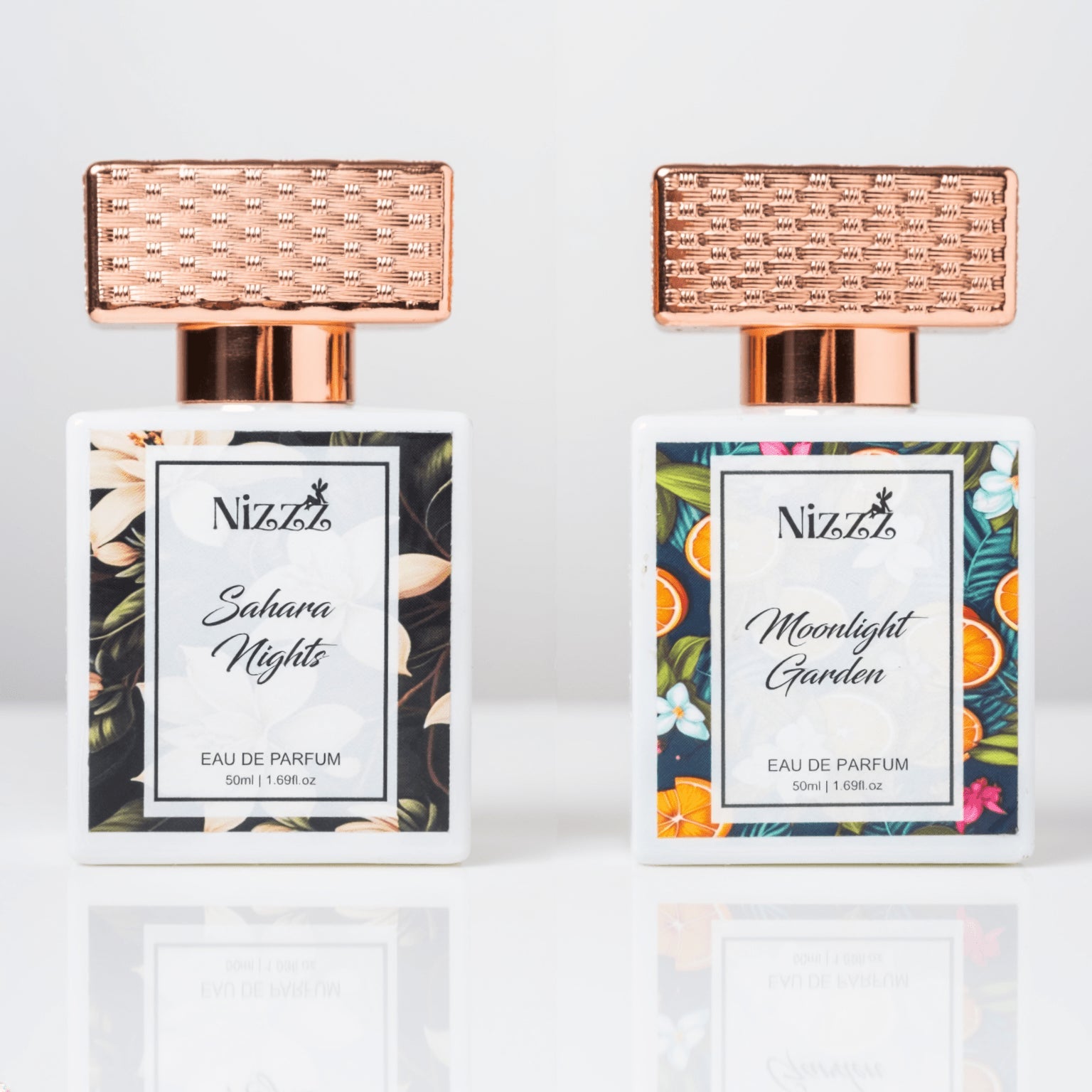 Two elegant floral perfume bottles with rose gold caps, Sahara Nights and Moonlight Garden eau de parfum