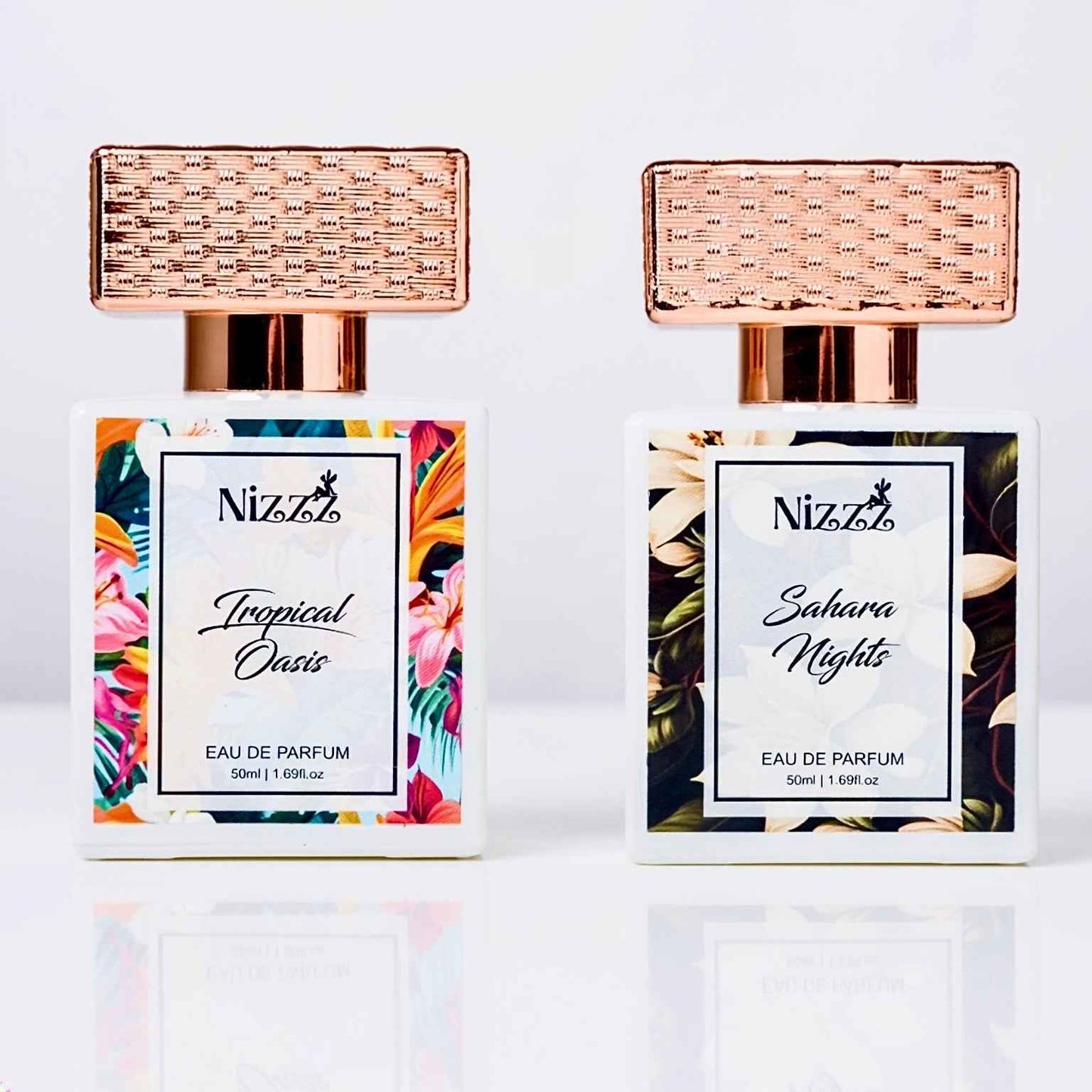 Tropical Oasis and Sahara Nights Eau de Parfum bottles with floral labels and rose gold caps