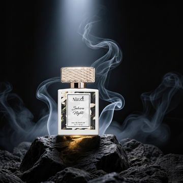Nizzz Sahara Nights luxury perfume bottle with smoke effect on dark rocky background