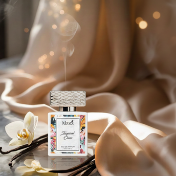 Perfume bottle with floral design on a beige fabric background