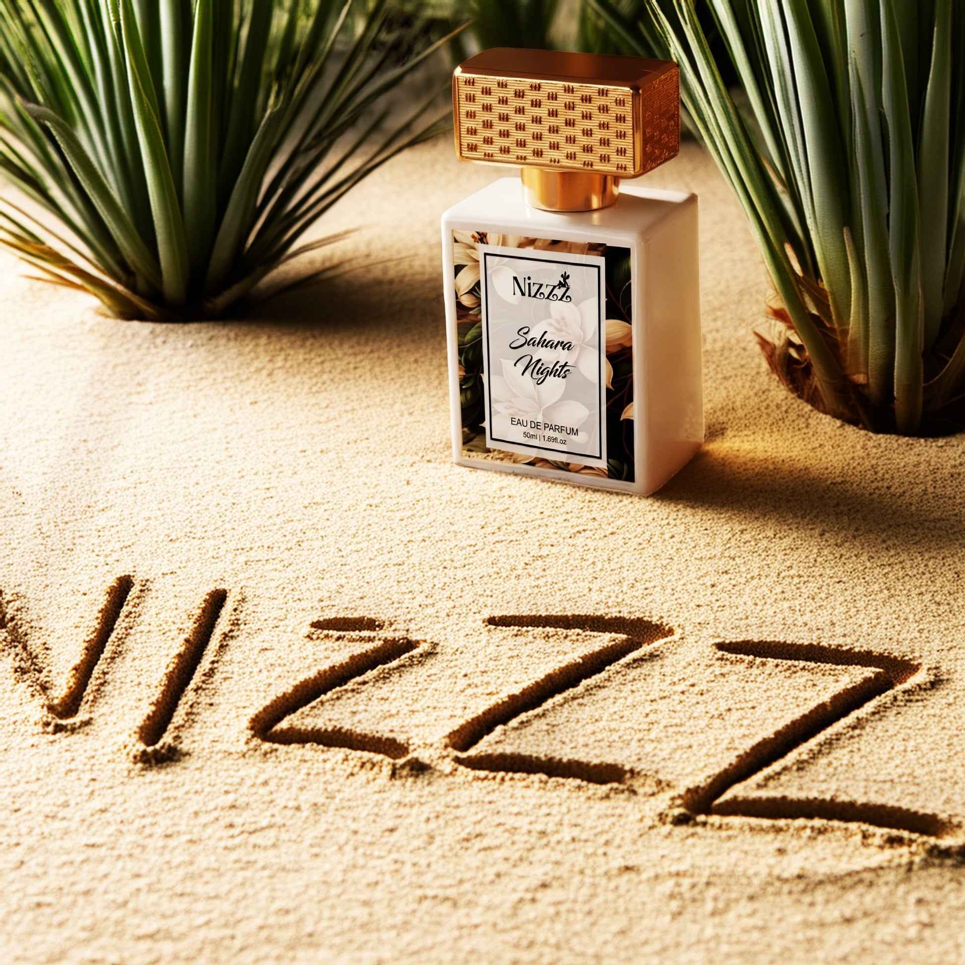 Nizzz Sahara Nights Eau de Parfum bottle on sandy beach with green plants, luxury floral fragrance